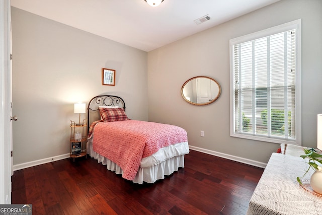 bedroom featuring dark hardwood / wood-style flooring