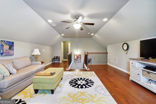 living room featuring ceiling fan, lofted ceiling, and dark hardwood / wood-style flooring