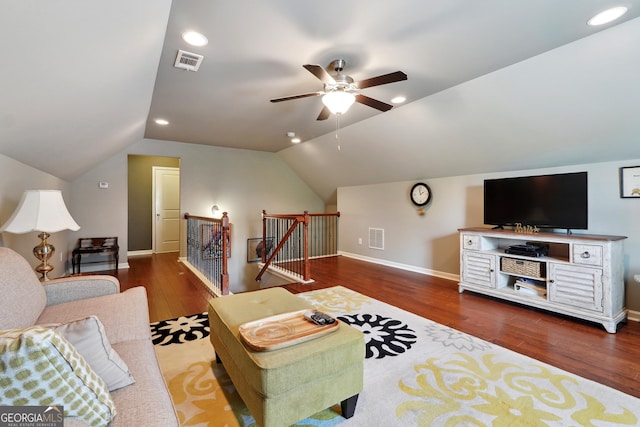 living room featuring lofted ceiling, dark wood-type flooring, and ceiling fan