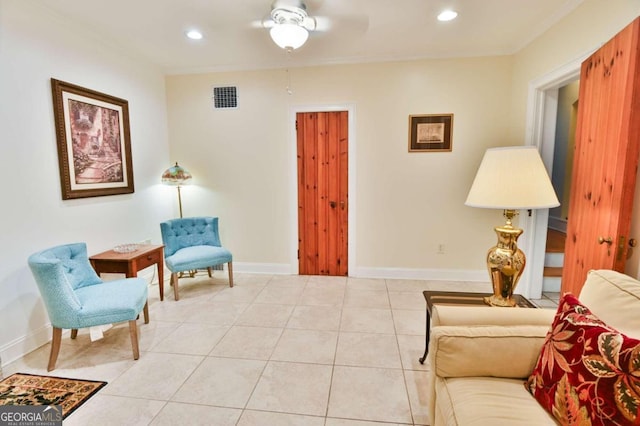 living area featuring ceiling fan and light tile patterned flooring