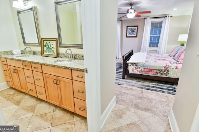 bathroom with tile patterned floors, ceiling fan, and dual bowl vanity