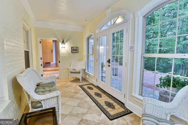 sunroom / solarium featuring french doors