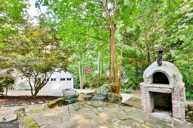 view of patio / terrace featuring a detached garage