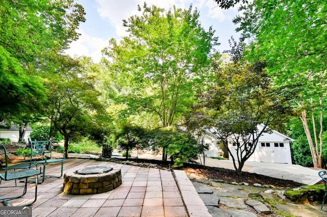 view of patio / terrace with an outdoor fire pit