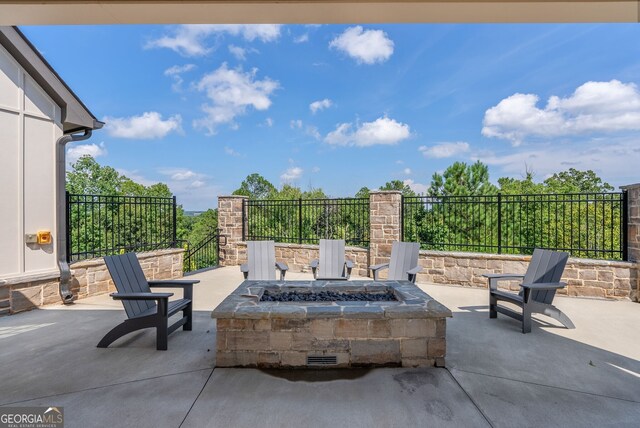 view of patio with an outdoor fire pit