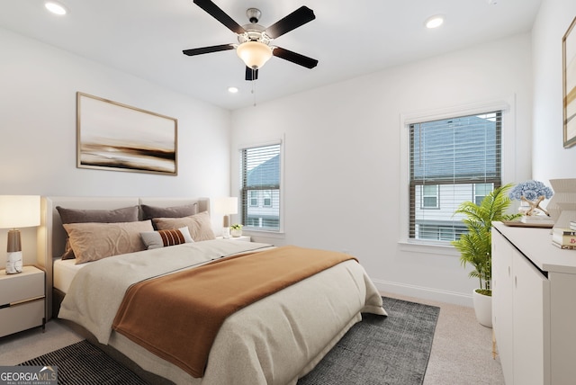 carpeted bedroom with ceiling fan