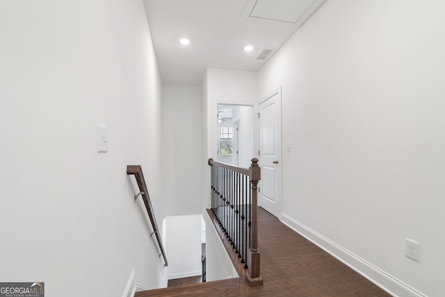 staircase with dark wood-type flooring