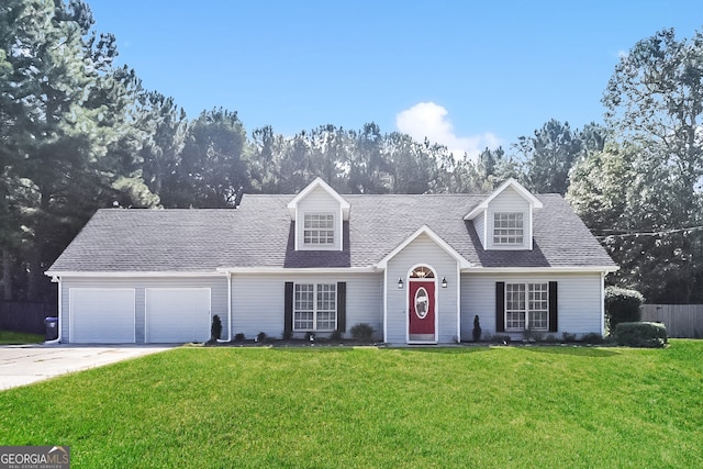 cape cod house with a garage and a front lawn