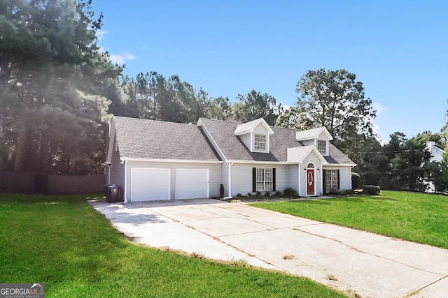 cape cod home featuring a garage and a front lawn