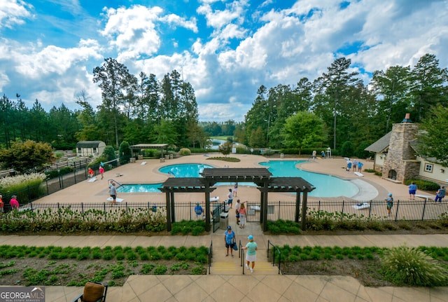 view of swimming pool featuring a patio area