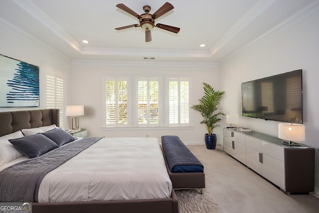 carpeted bedroom with crown molding, a raised ceiling, and ceiling fan