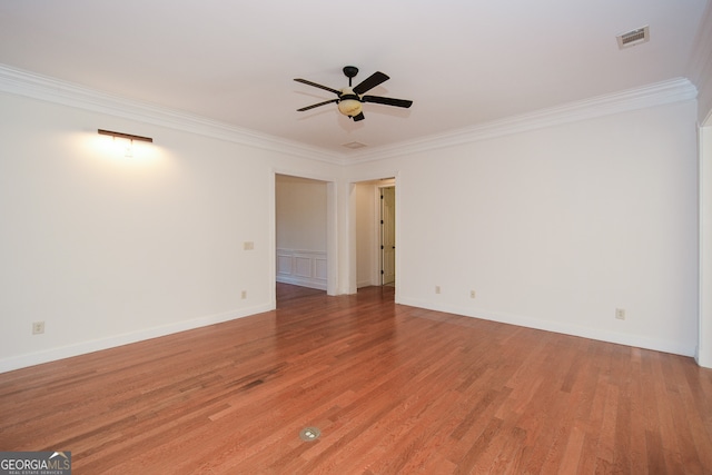 spare room with light hardwood / wood-style floors, crown molding, and ceiling fan