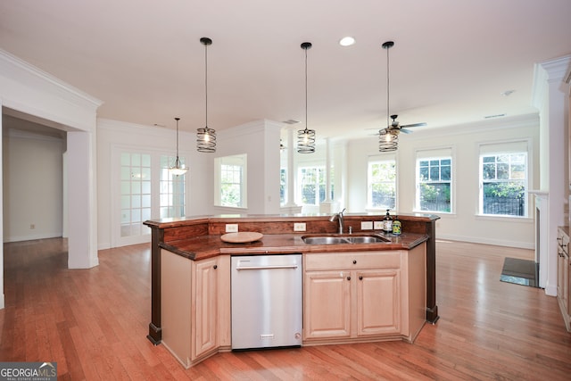 kitchen with stainless steel dishwasher, sink, a kitchen island with sink, and plenty of natural light