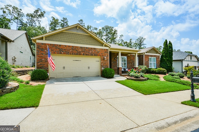 view of front of house featuring a garage and a front lawn