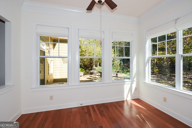 unfurnished sunroom with ceiling fan