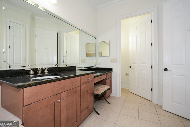 bathroom with vanity, ornamental molding, and tile patterned floors