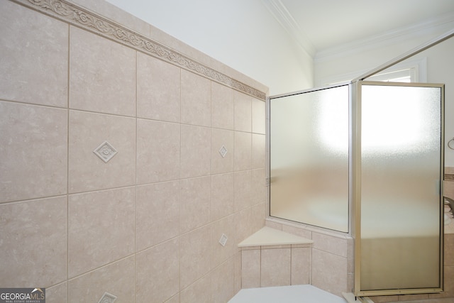 bathroom with crown molding and an enclosed shower