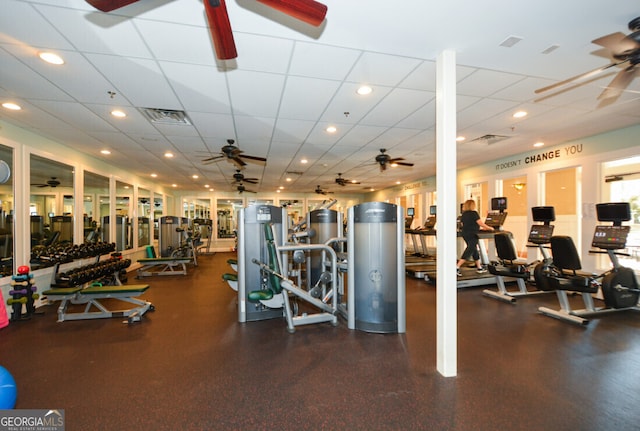 exercise room featuring a paneled ceiling