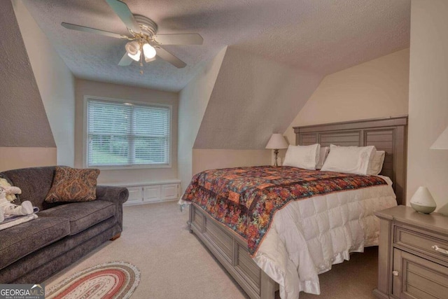 carpeted bedroom featuring a textured ceiling, ceiling fan, and vaulted ceiling