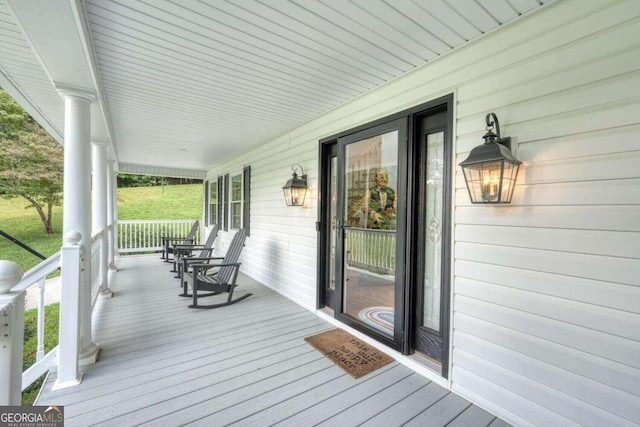 wooden terrace with a porch