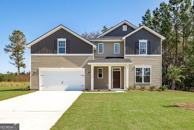 view of front of property featuring a garage and a front lawn