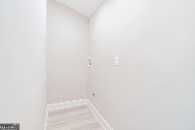 laundry area with washer hookup and light wood-type flooring