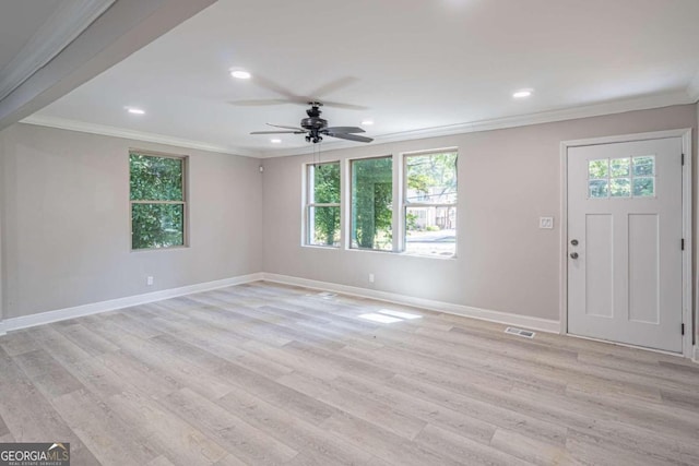 foyer featuring ornamental molding, ceiling fan, and light wood-type flooring