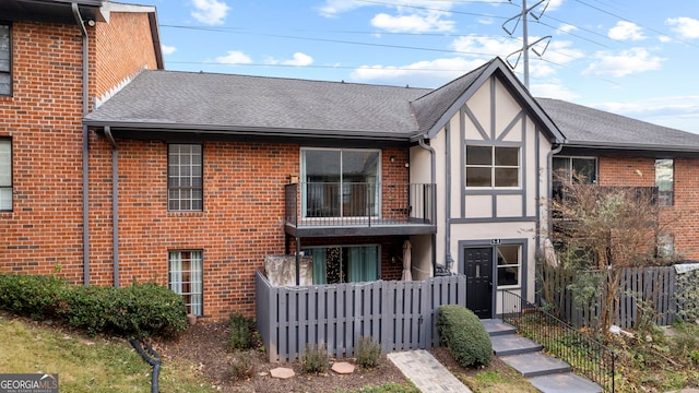 view of front of property with a balcony