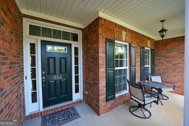 property entrance featuring covered porch