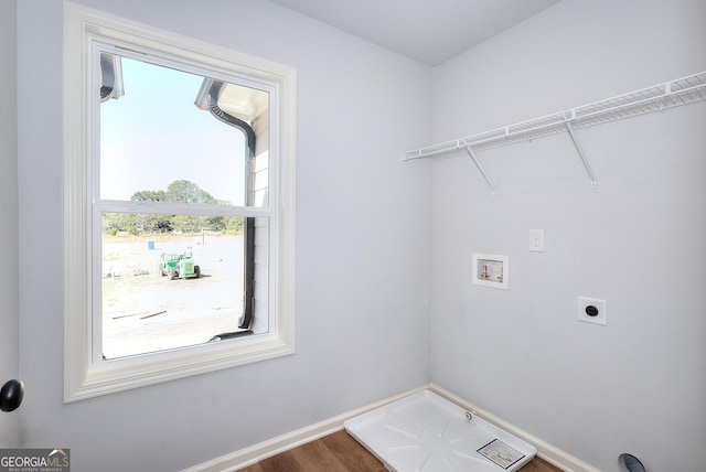 washroom featuring hardwood / wood-style floors, hookup for a washing machine, and hookup for an electric dryer