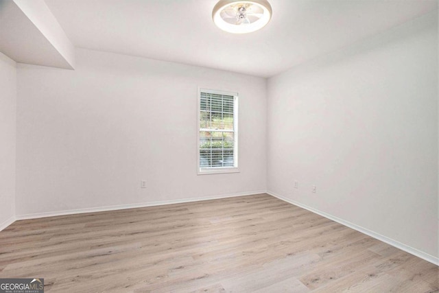 spare room with light wood-type flooring