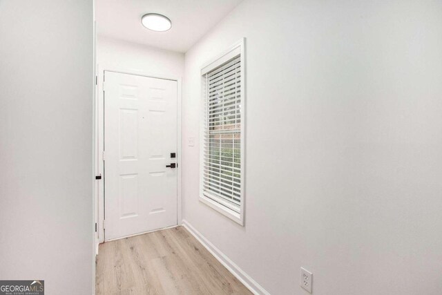 doorway to outside with light hardwood / wood-style flooring