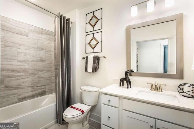 full bathroom with vanity, toilet, and shower / bathtub combination with curtain