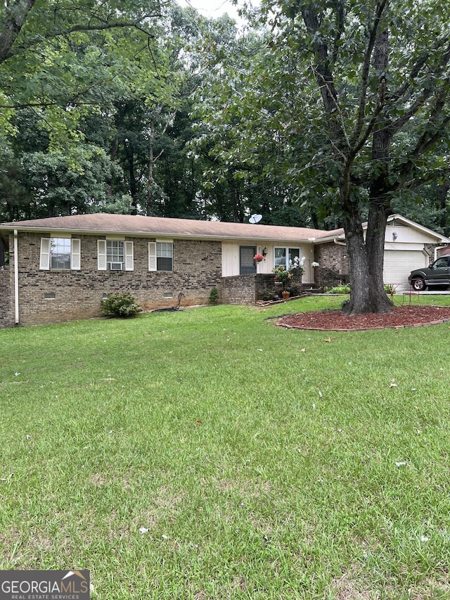 ranch-style house with a garage, a front yard, crawl space, and brick siding