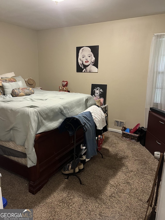 bedroom with carpet floors and visible vents