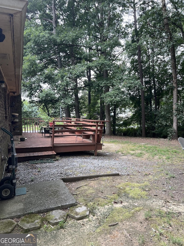 view of yard with a wooden deck