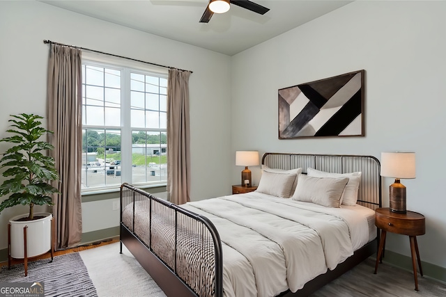 bedroom featuring ceiling fan and hardwood / wood-style floors