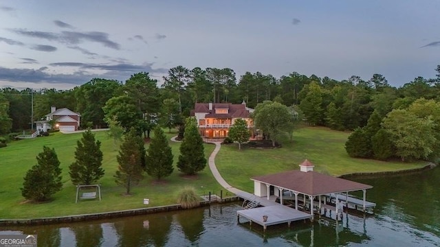 birds eye view of property with a water view