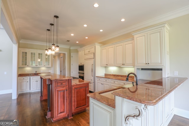 kitchen with a breakfast bar, kitchen peninsula, crown molding, stone countertops, and dark hardwood / wood-style flooring