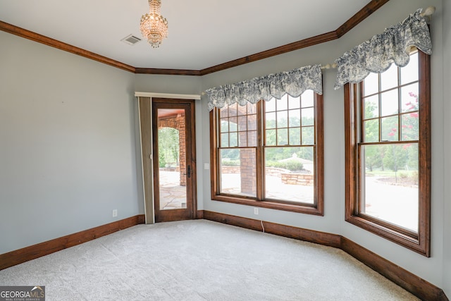 carpeted spare room with crown molding