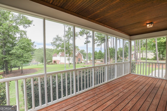 unfurnished sunroom featuring wooden ceiling