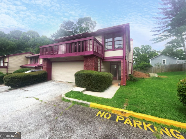 view of front of house with a garage and a front yard