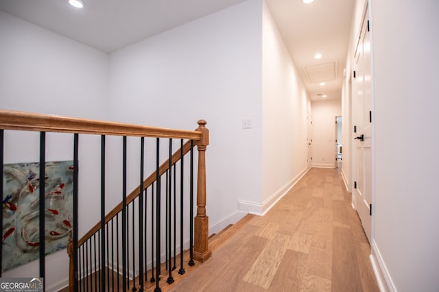 corridor with light hardwood / wood-style flooring