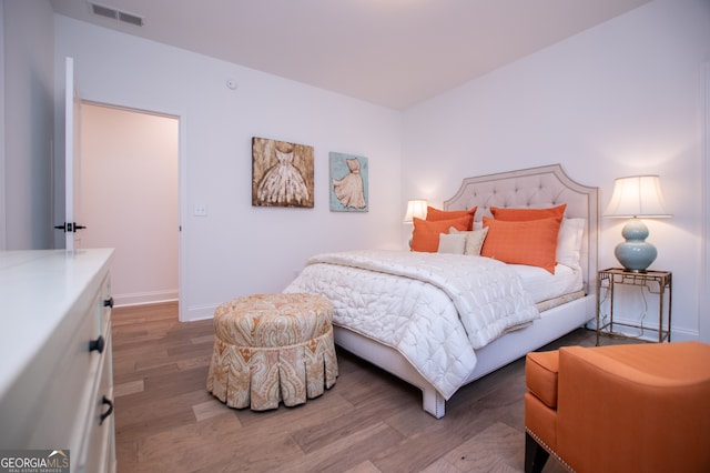 bedroom with wood-type flooring