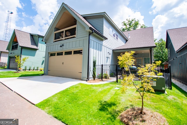 view of front of house featuring a garage and a front lawn