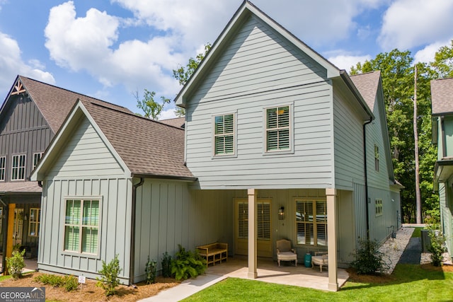 rear view of property featuring a patio