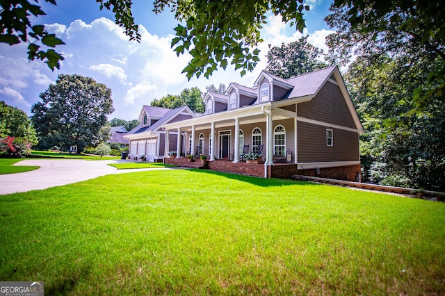 cape cod-style house with a front lawn and a porch