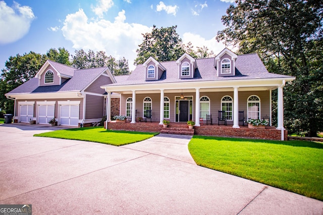 cape cod-style house featuring a garage, covered porch, and a front lawn