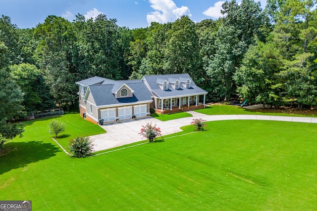 new england style home featuring covered porch and a front lawn