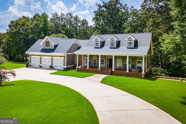 cape cod house with a garage, covered porch, and a front lawn